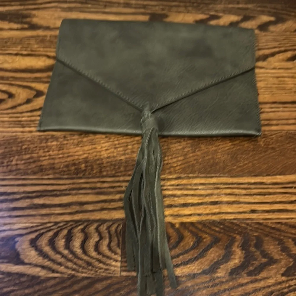 Anthropologie Street Level faux pebbled leather olive tasseled envelope clutch.
